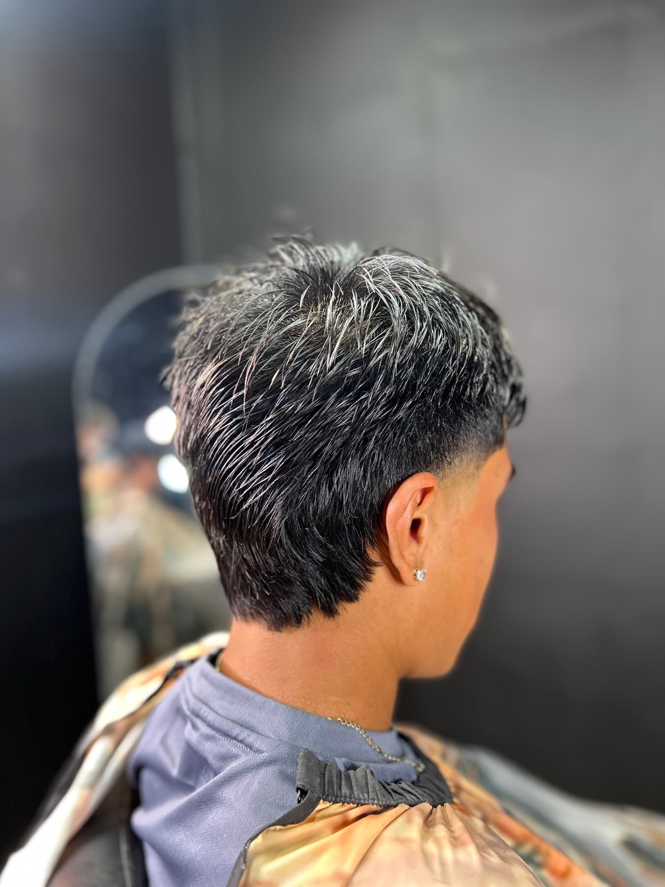 Fresh taper fade haircut at a barbershop